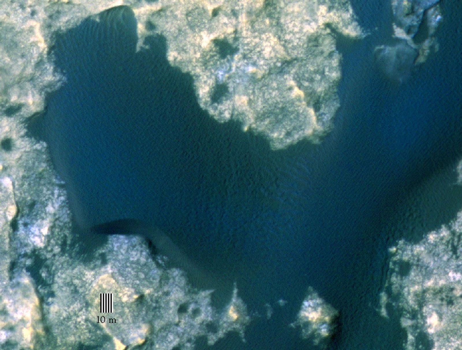 This view taken from orbit around Mars shows the sand dune that will be the first to be visited by NASA's Curiosity Mars Rover along its route to higher layers of Mount Sharp.