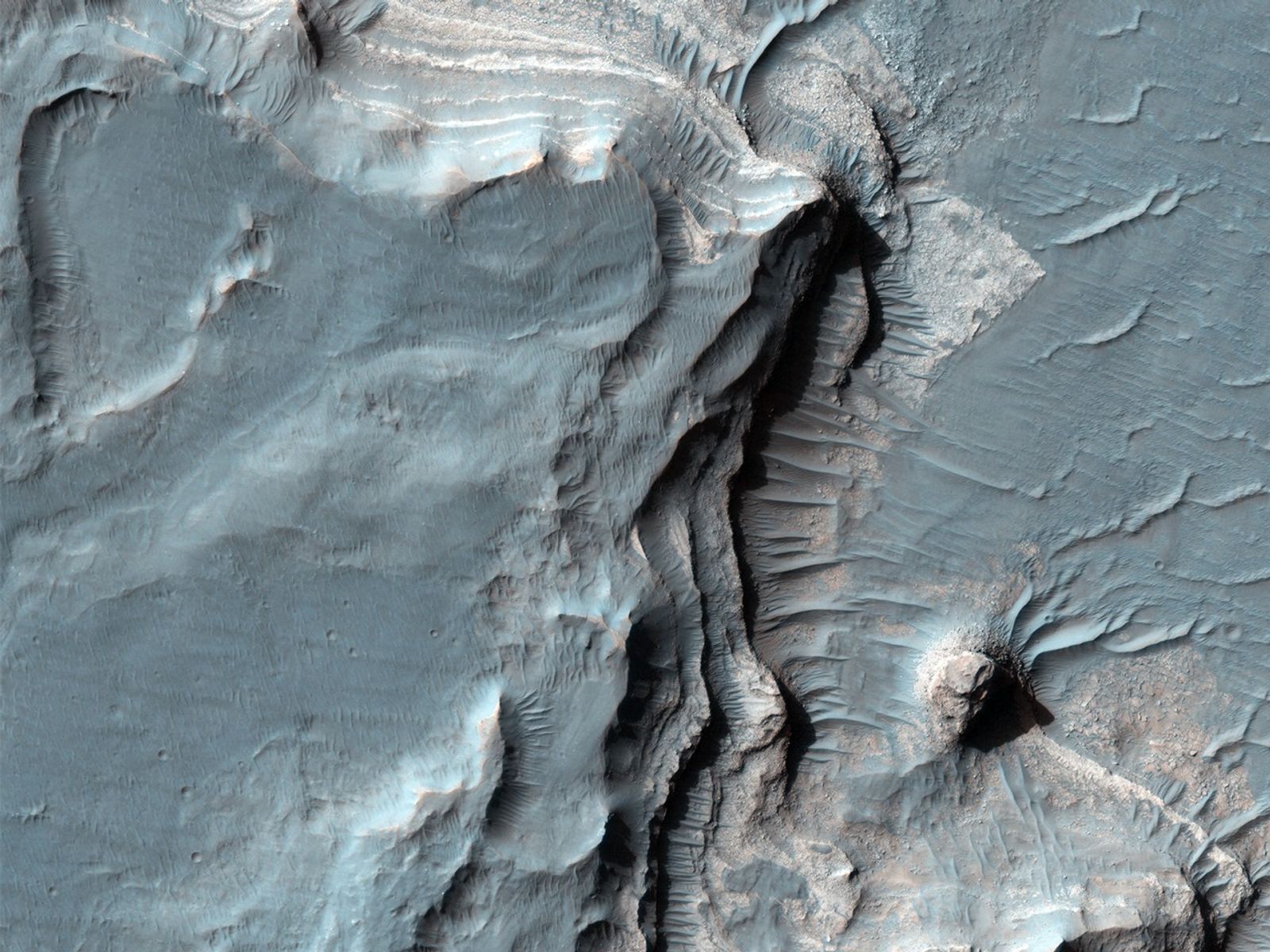 Eberswalde Crater contains layered rocks about 100-meters thick exposed in a a well-preserved delta.
