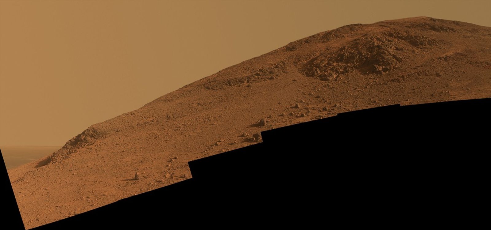 This scene from NASA's Mars Exploration Rover Opportunity looks upward at "Knudsen Ridge" on the southern edge of "Marathon Valley" from inside the valley.