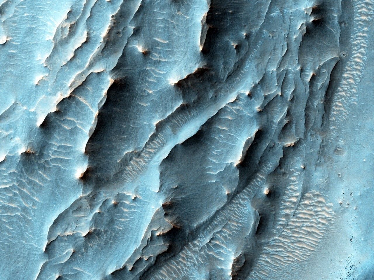 NASA's Mars Reconnaissance Orbiter, nearing the 10th anniversary of its arrival at Mars, used its High Resolution Imaging Science Experiment (HiRISE) camera to obtain this view of an area with unusual texture on the southern floor of Gale Crater.