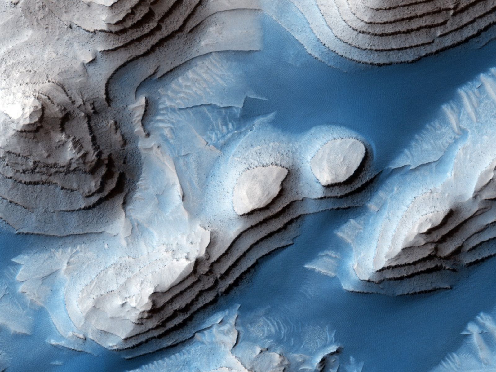 This crater is named for G. Edward Danielson, Jr. who was instrumental in the development of a series of Mars cameras, from Mariner 4 launched in 1964 to the Mars Global Surveyor launched in 1996.