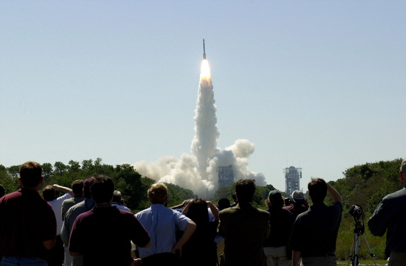 At 11:02 a.m. EDT on April 7, 2001, crowds watch a Boeing Delta II rocket lift off from Cape Canaveral Air Force Station, Florida, carrying NASA's 2001 Mars Odyssey spacecraft into space on its seven-month journey to Mars.
