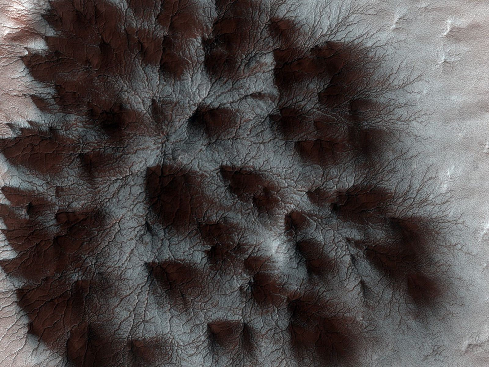 As the Sun peeks above the horizon at the Martian south polar icecap, powerful jets of carbon-dioxide (CO2) gas erupt through the icecap's topmost layer.