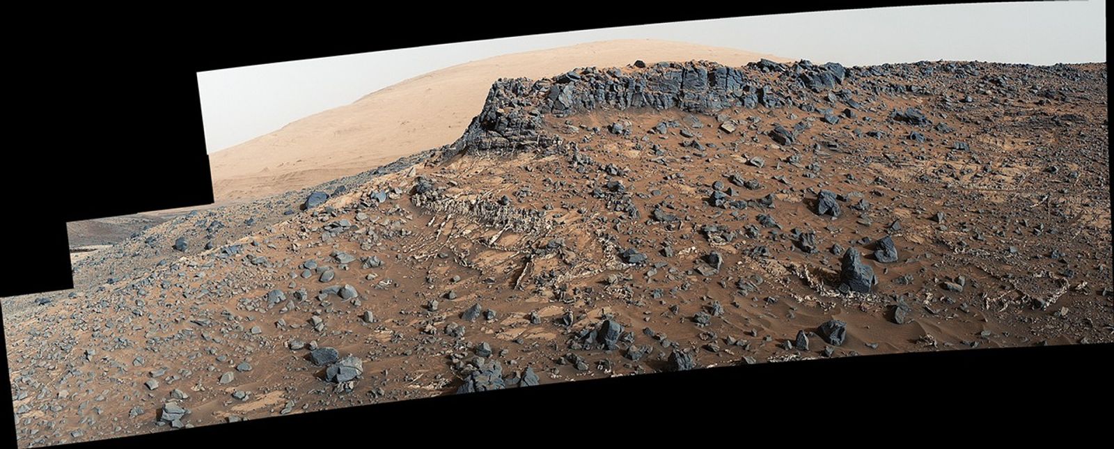 This March 27, 2015, view from the Mast Camera (Mastcam) on NASA's Curiosity Mars rover shows a site with a network of prominent mineral veins below a cap rock ridge on lower Mount Sharp. At this "Garden City" site, the veins have been more resistant to erosion than the surrounding host rock.