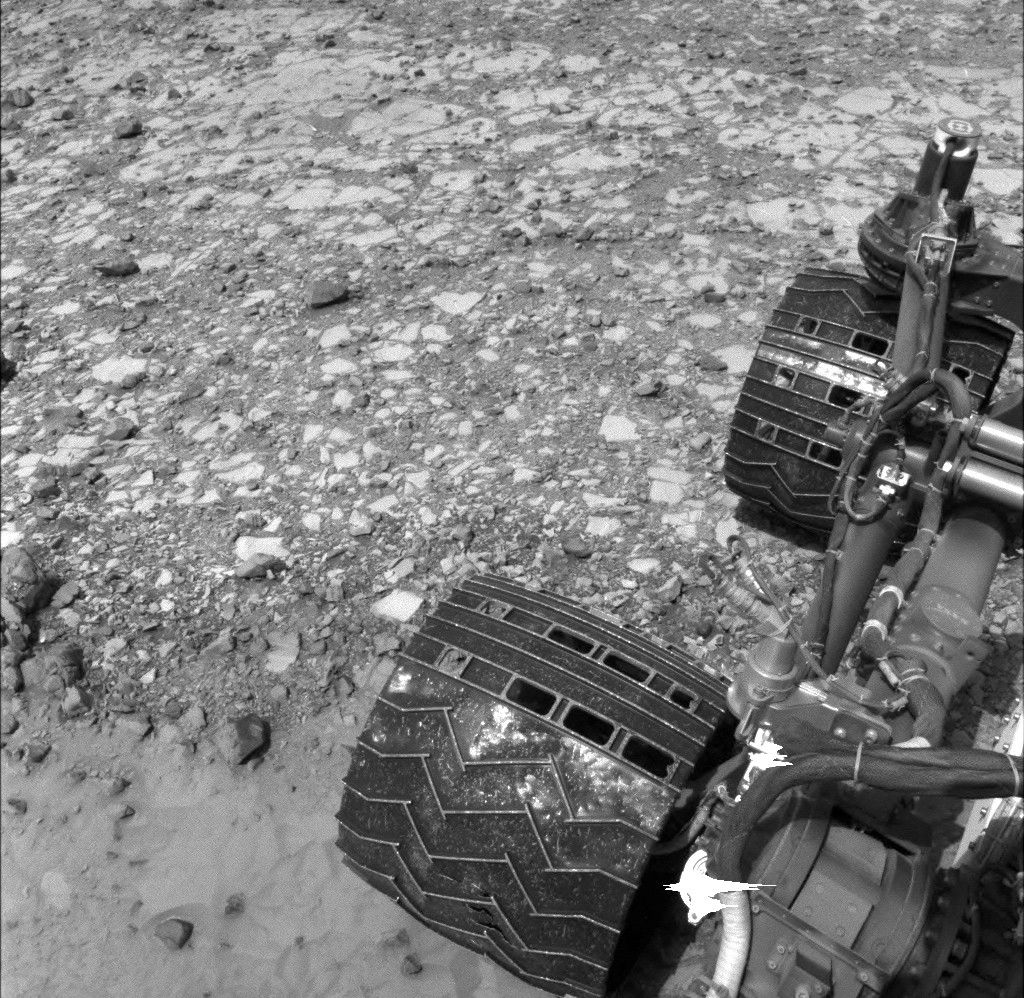 NASA's Curiosity Mars rover used its Navigation Camera (Navcam) to capture this view partway back down a slope it climbed toward "Marias Pass" on lower Mount Sharp.
