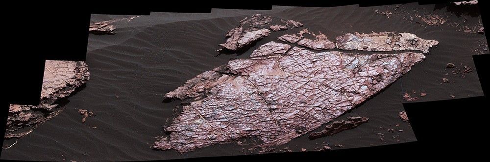 This view of a Martian rock slab called "Old Soaker," which has a network of cracks that may have originated in drying mud, comes from the Mast Camera (Mastcam) on NASA's Curiosity Mars rover. It was taken on Dec. 20, 2016. The slab is about 4 feet long.