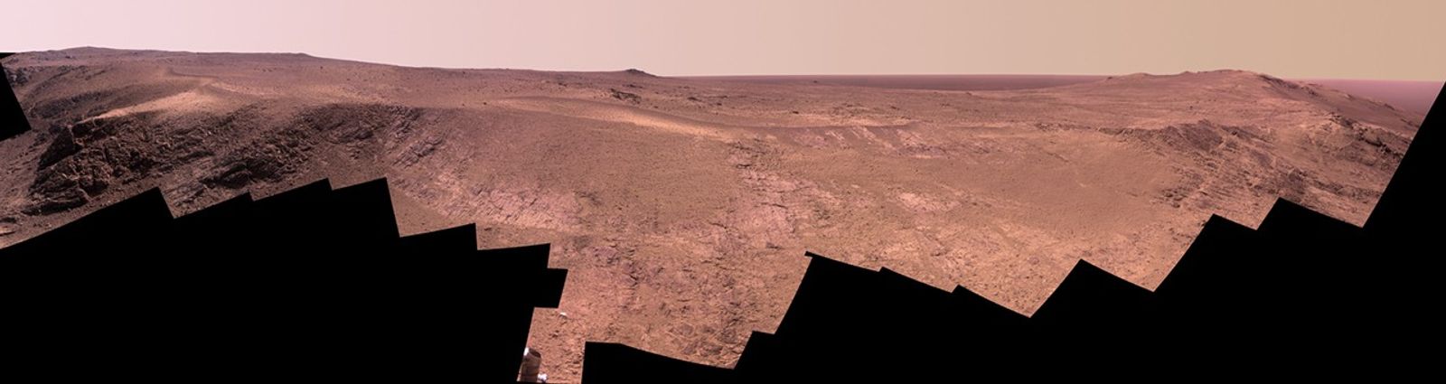 A grooved ridge called "Rocheport" on the rim of Mars' Endeavour Crater spans this scene from the Pancam on NASA's Mars rover Opportunity. The view extends from south-southeast on the left to north on the right. The site is near the southern end of an Endeavour rim segment called "Cape Tribulation."