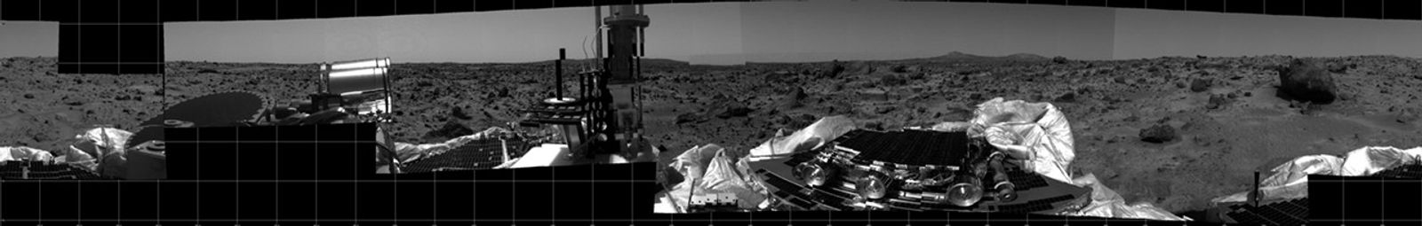 This photomosaic was taken by the Imager for Mars Pathfinder (IMP) camera on July 4, 1997 between 4:00-4:30 p.m. PDT. The foreground is dominated by the lander, newly renamed the Sagan Memorial Station after the late Dr. Carl Sagan.