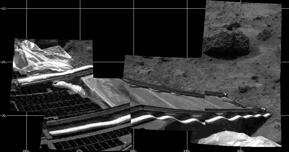 NASA Mars Pathfinder's rear rover ramp can be seen successfully unfurled in this image, taken at the end of July 5, 1997 Sol 2 by the Imager for Mars Pathfinder (IMP).