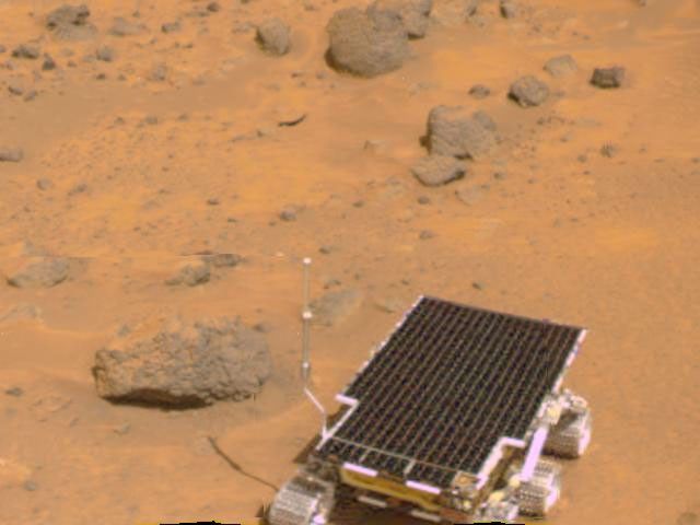 The Mars rover Sojourner is visible in this color image, one of the first taken by the deployed NASA's Imager for Mars Pathfinder (IMP) on July 7, 1997.