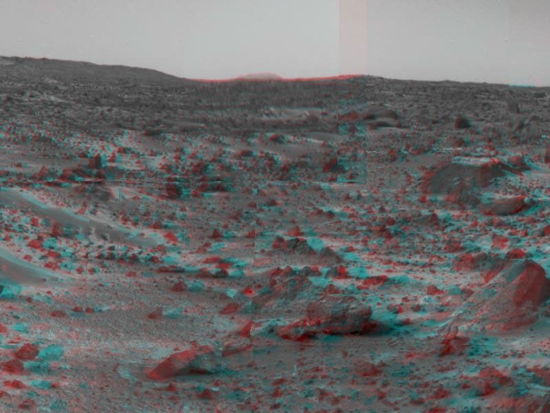 An area of rough Martian terrain is prominent in this stereo image, taken by NASA's Mars Pathfinder on Sol 3, 1997. 3D glasses are necessary to identify surface detail. The large rock dubbed 'Wedge' is at lower right.