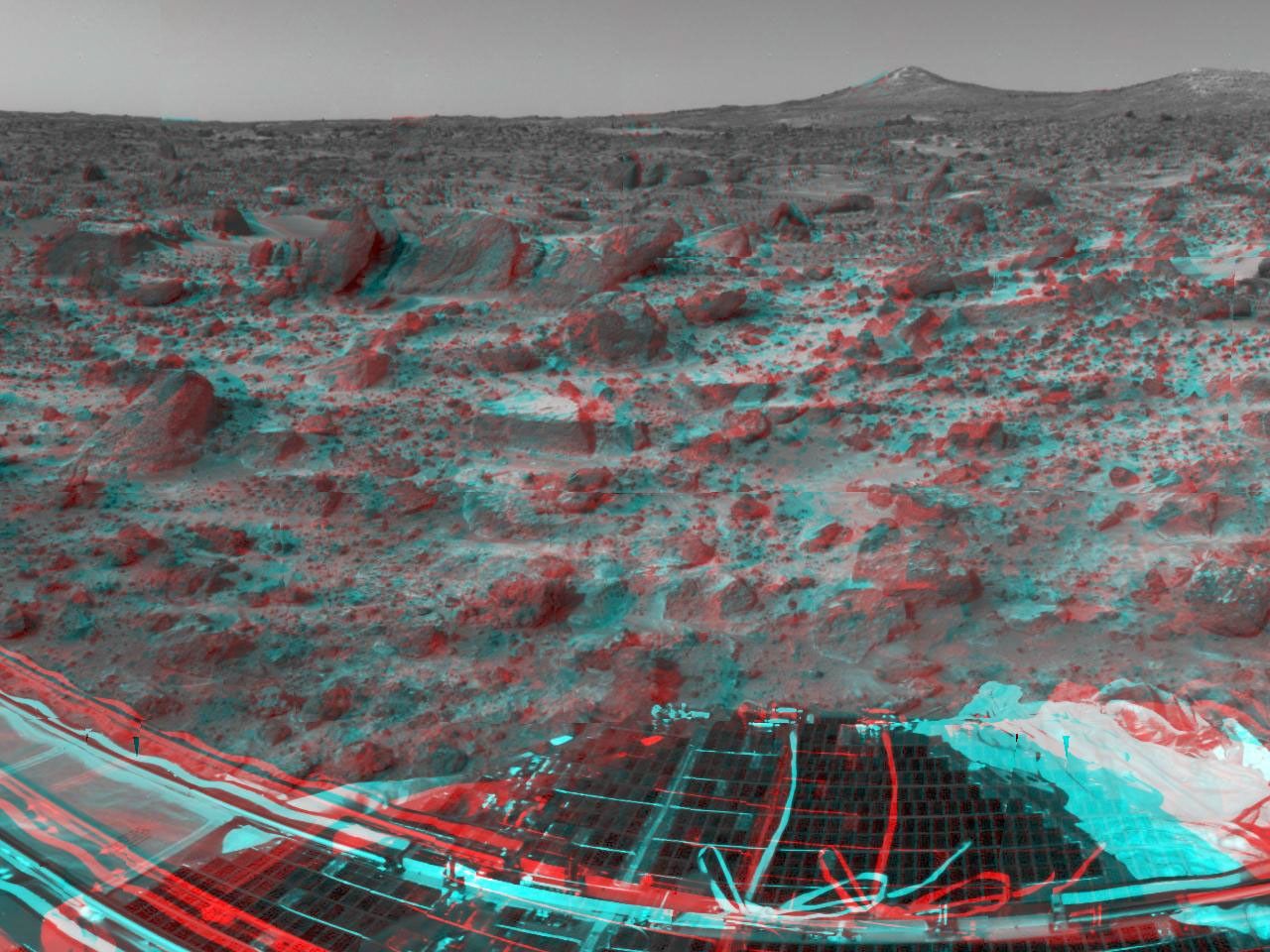 Many prominent rocks near the Sagan Memorial Station are featured in this image, from NASA's Mars Pathfinder. 'Flat Top' and 'Little Flat Top' are at center. 3-D glasses are necessary to identify surface detail.