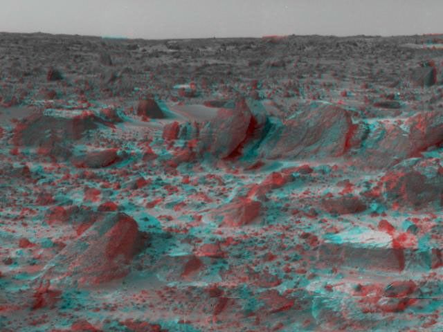 Many prominent rocks near the Sagan Memorial Station are featured in this image from NASA's Mars Pathfinder. 'Shark', 'Half-Dome', and 'Pumpkin' are at center 3D glasses are necessary to identify surface detail.