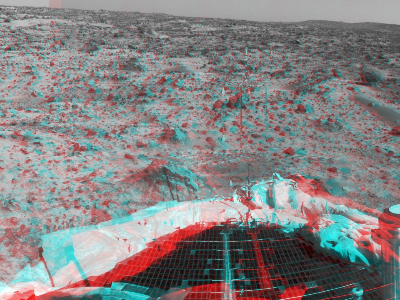 Portions of the lander's deflated airbags and a petal are at lower left in this image from NASA's Mars Pathfinder. 3D glasses are necessary to identify surface detail.