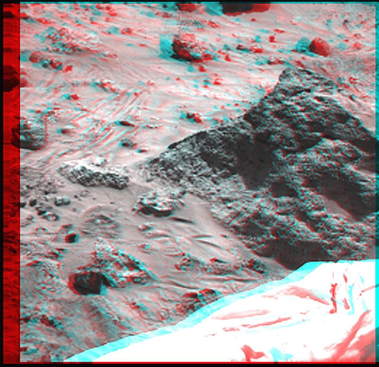 The 'Mini Matterhorn' is a 3/4 meter rock immediately east-southeast of NASA's Mars Pathfinder lander. 3D glasses are necessary to identify surface detail.