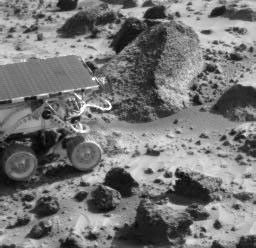 The Sojourner rover is next to the rock 'Wedge' in this image taken on Sol 35 by NASA's Imager for Mars Pathfinder (IMP). Sol 1 began on July 4, 1997.