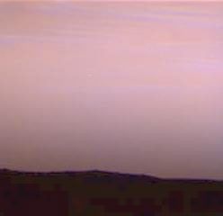 On Sol 39 there were wispy blue clouds in the pre-dawn sky of Mars, as seen by NASA's Imager for Mars Pathfinder (IMP). The image was made by taking blue, green, and red images, then combining them into a single color image. Sol 1 began on July 4, 1997.