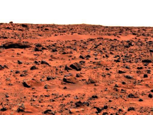 This enhanced color image of the Pathfinder landing site shows the eastern horizon. The elongated, reddish, low contrast region in the distance is 'Roadrunner Flats.' This image was taken by by NASA's Mars Pathfinder (MPF).