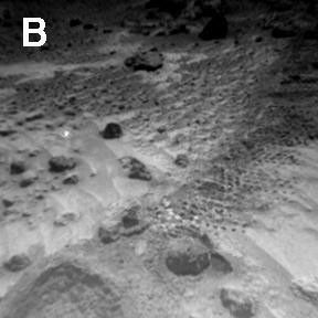 NASA's Sojourner Rover image of rounded 4-cm-wide pebble (lower center)and excavation of cloddy deposit of 'Cabbage Patch' at lower left. Note the bright wind tails of drift material extending from small rocks. Sol 1 began on July 4, 1997.