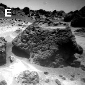 NASA's Sojourner observations in the Ares region on Mars raise and answer questions about the origins of the rocks and other deposits found there. This image shows the vesicular and pitted textures of Souffle Rock. Sol 1 began on July 4, 1997.