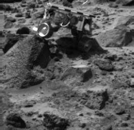 Sojourner's left rear wheel is perched on the rock "Wedge" in this image, taken on Sol 47 by the Imager for Mars Pathfinder (IMP)
