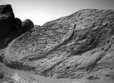 This image of the rock 'Half Dome' was taken by NASA's Sojourner rover's left front camera on Sol 71 (September 14). Pits, linear textures, and pronounced topography on the rock are clearly visible. Sol 1 began on July 4, 1997.