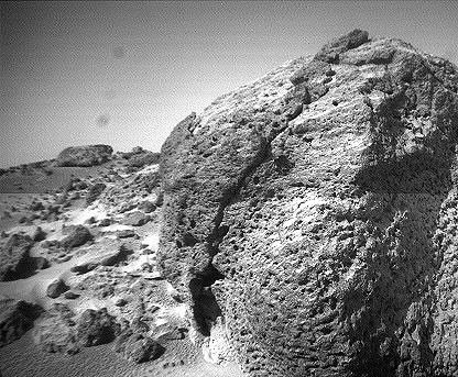 This view of the rock 'Chimp' was acquired by NASA's Sojourner rover's left front camera on Sol 74 (September 17). A large crack, oriented from lower left to upper right, is visible in the rock. Sol 1 began on July 4, 1997.