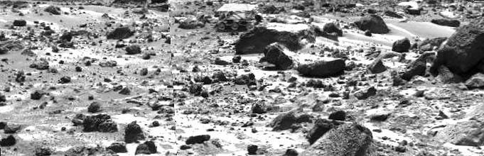 This left image of a stereo image pair taken on the afternoon of Sol 74 (September 17) shows NASA's Sojourner rover behind the rock 'Chimp.' Sojourner is now a record 12.3 m from the lander. Sol 1 began on July 4, 1997.
