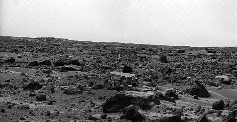 Noontime on Sol 75 (September 18). The rover's middle right wheel is raised above the surface. Sojourner is over 12 m from the lander, a mission record. The image was taken by NASA's Imager for Mars Pathfinder (IMP). Sol 1 began on July 4, 1997.