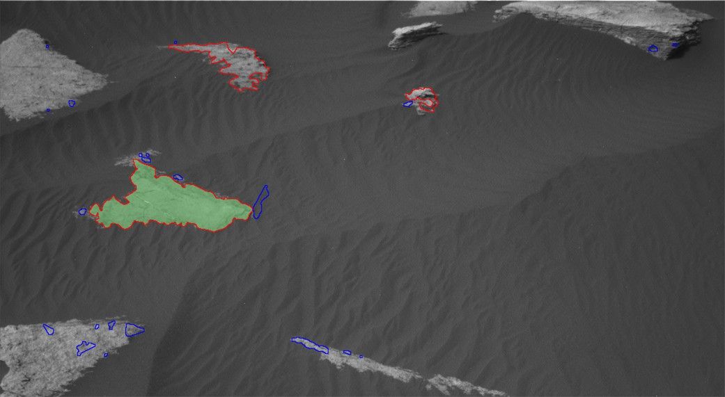 This is how AEGIS sees the Martian surface. All targets found by the A.I. program are outlined: blue targets are rejected, while red are retained. The top-ranked target is shaded green; if there's a second-ranked target, it's shaded orange. These NavCam images have been contrast-balanced.