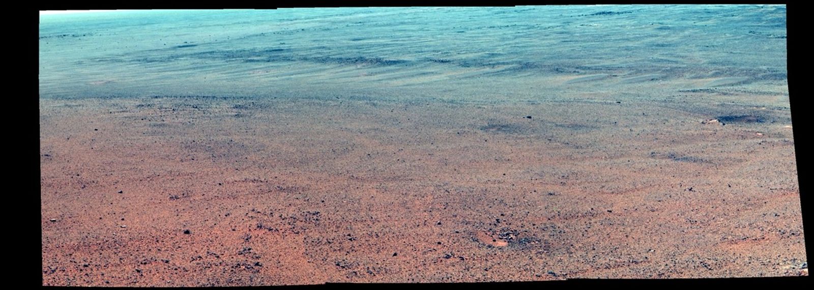 The Pancam on NASA's Mars Exploration Rover Opportunity took the component images of this enhanced-color scene during the mission's "walkabout" survey of an area just above the top of "Perseverance Valley," in preparation for driving down the valley.
