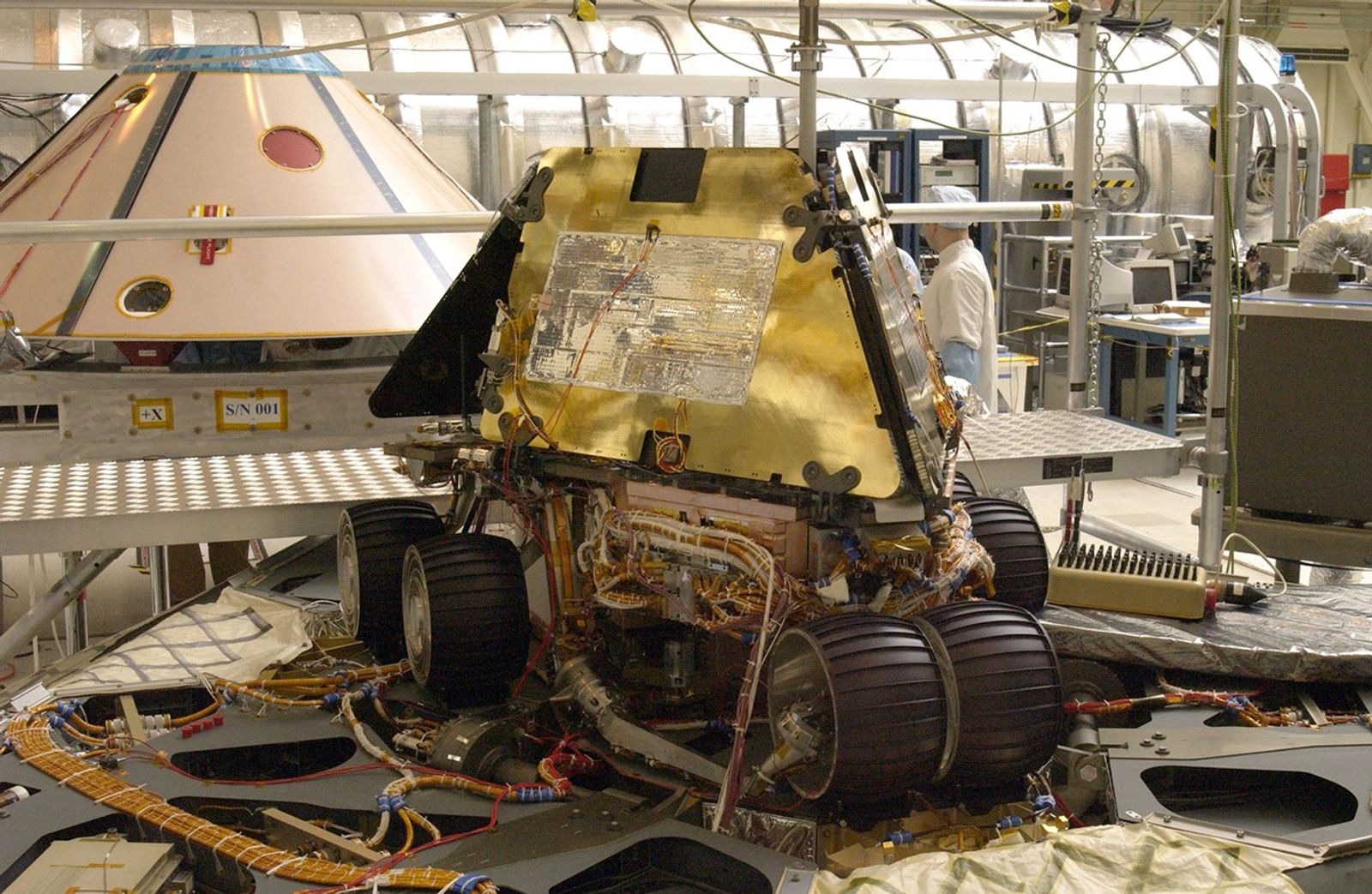 Rover 1 sits atop the deployed lander with its solar arrays and wheels stowed.