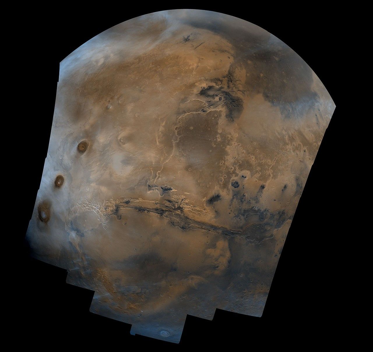 Mosaic composed of 102 Viking Orbiter images of Mars, covering nearly a full hemisphere of the planet (approximate latitude -55 to 60 degrees, longitude 30 to 130 degrees).