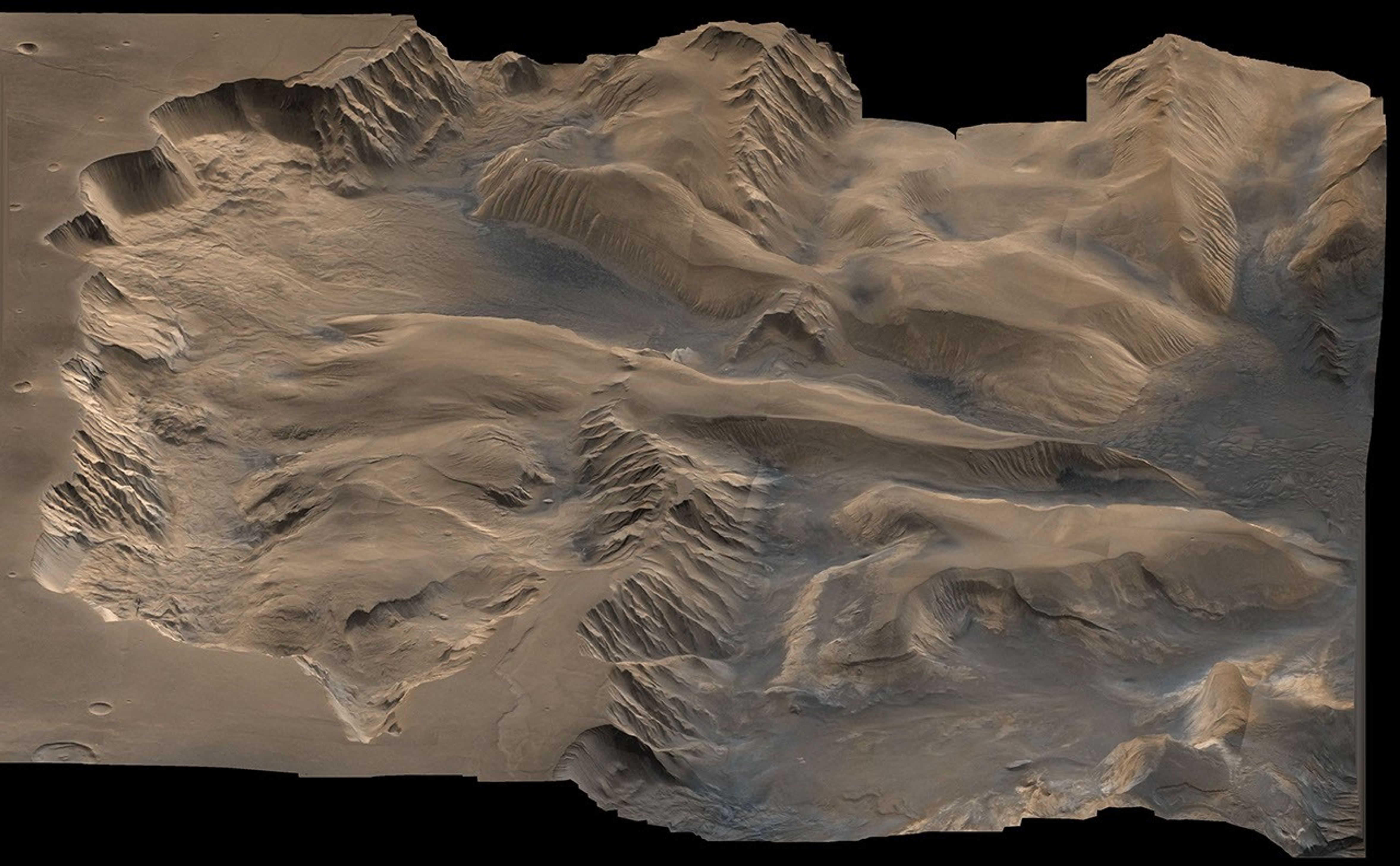 An oblique, color image of central Valles Marineris, Mars showing relief of Ophir and Candor Chasmata; view toward east. The photograph is a composite of Viking high-resolution images in black and white and low-resolution images in color.