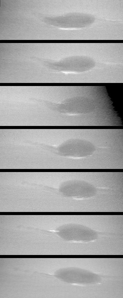 These images taken by NASA's Voyager 2 show changes in the clouds around Neptune's Great Dark Spot (GDS) over a four and one-half-day period. From top to bottom the images show successive rotations of the planet an interval of about 18 hours.