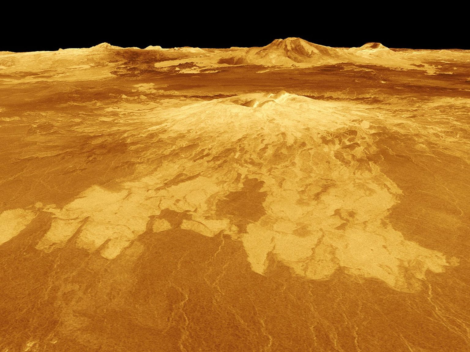 Sapas Mons is displayed in the center of this computer-generated three-dimensional perspective view from NASA's Magellan spacecraft of the surface of Venus.
