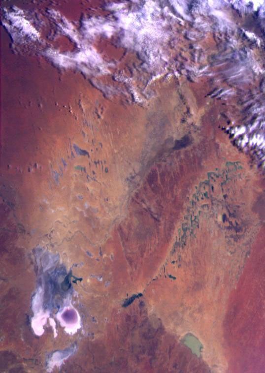 This color image of the Simpson Desert in Australia was obtained by NASA's Galileo spacecraft at about 2:30 p.m. PST, Dec. 8, 1990, at a range of more than 35,000 miles.