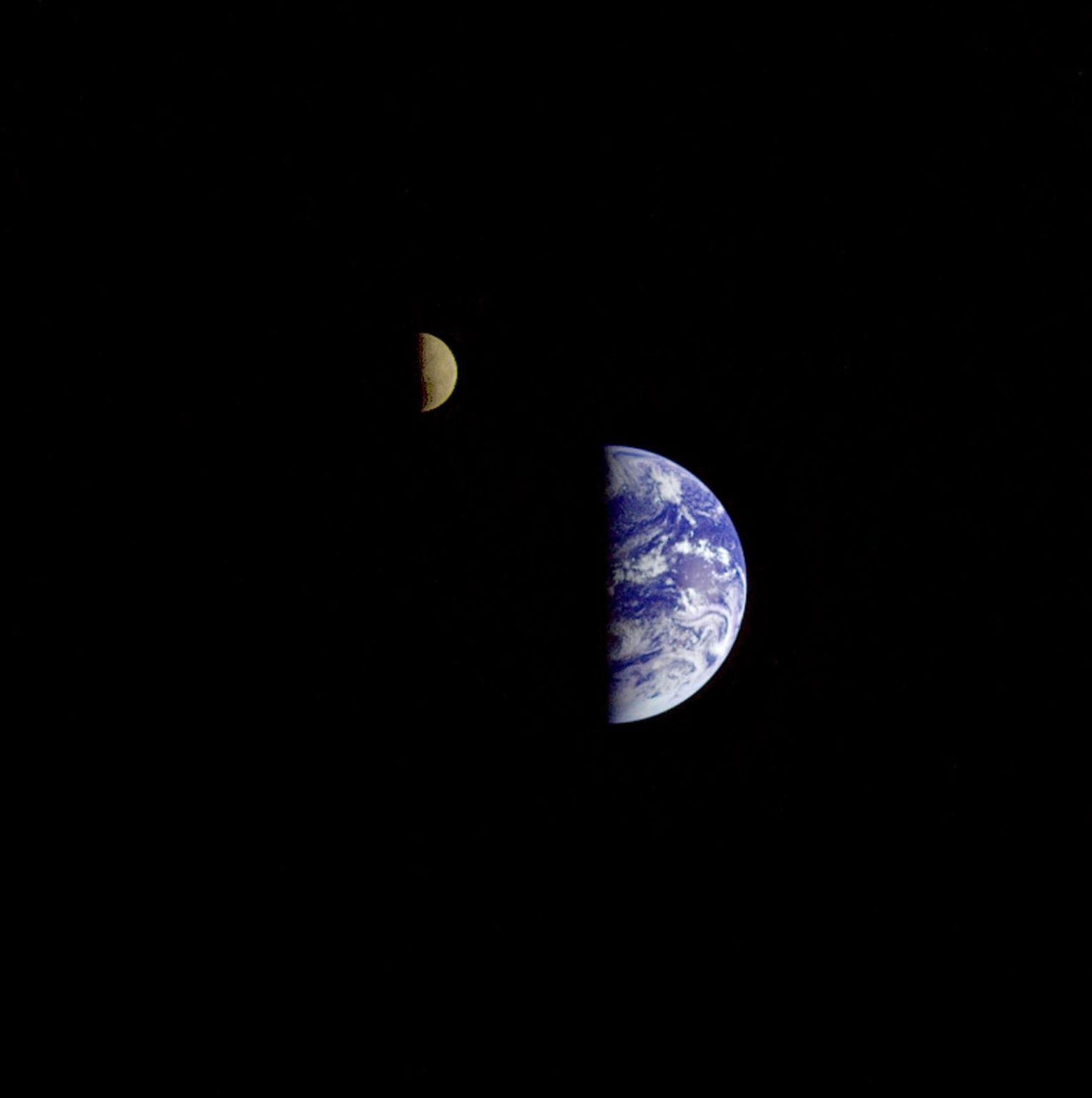 Earth Moon conjuntion image created during the second flyby of NASA's Galileo's spacecraft. Brightly colored Earth contrasts strongly with the Moon.