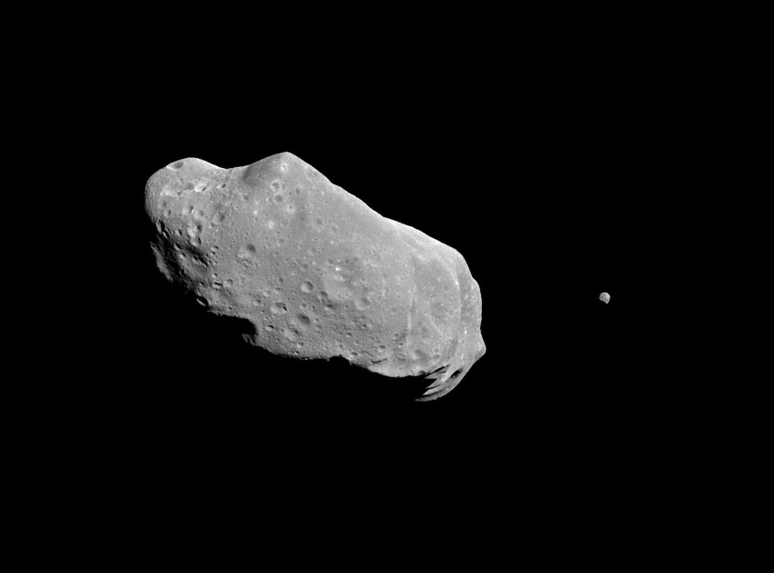 This is the first full picture showing both asteroid 243 Ida and its newly discovered moon to be transmitted to Earth NASA's Galileo spacecraft -- the first conclusive evidence that natural satellites of asteroids exist.