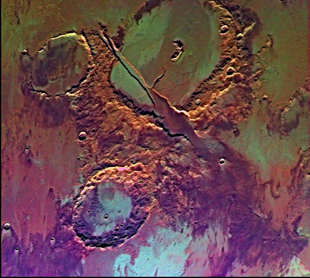 Tharsis-centered volcanic and tectonic activity resulted in the formation of radial grabens of Memnonia Fossae, which cut materials of the ancient cratered highlands and relatively young, highland-embaying lava flows as seen by NASA's Viking Orbiter 2.