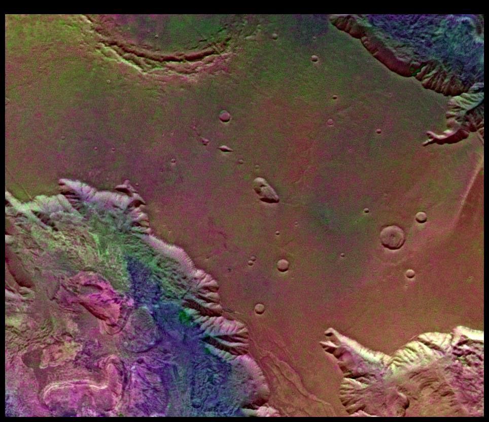 This picture from NASA's Viking Orbiter 2 shows areas of central Valles Marineris, Mars, including Candor Chasm (lower left), Ophir Chasm (lower right), and Hebes Chasm (upper right).