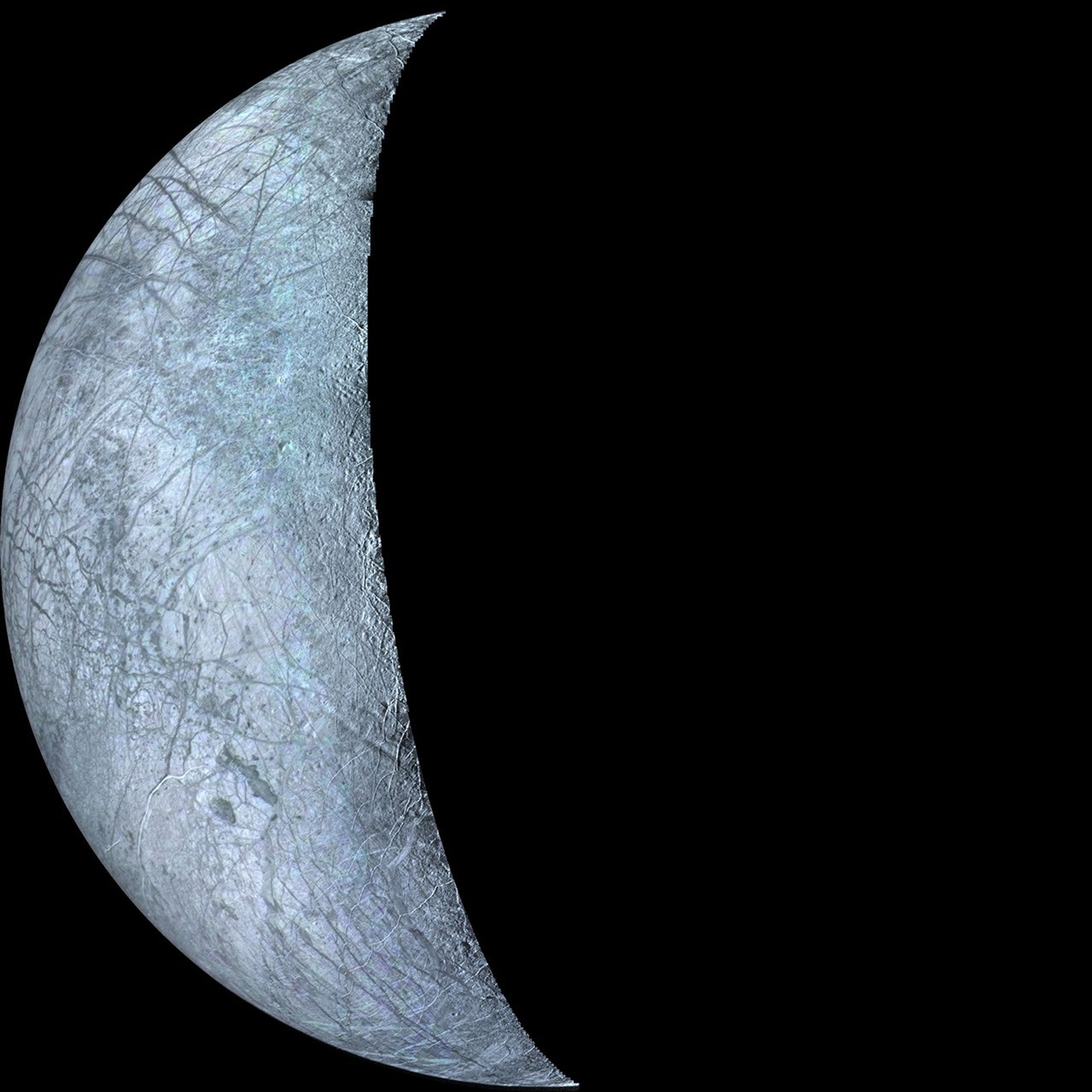 This archival image taken by NASA's Voyager 2, is of Europa, the smallest Galilean satellite. The bright areas are probably ice deposits, whereas the darkened areas may be the rocky surface or areas with a more patchy distribution of ice.