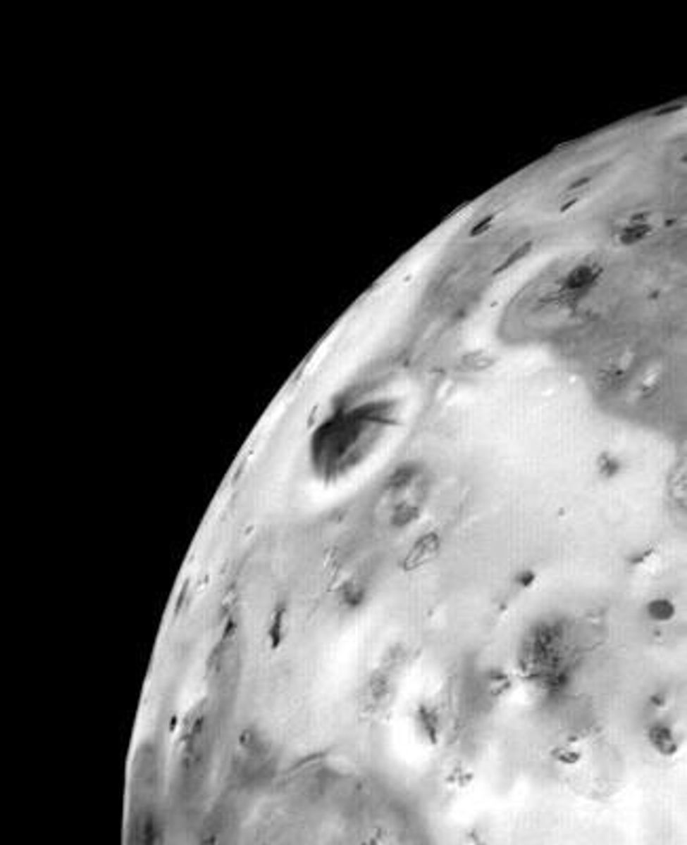Voyager 1 image showing a volcanic plume erupting from Io