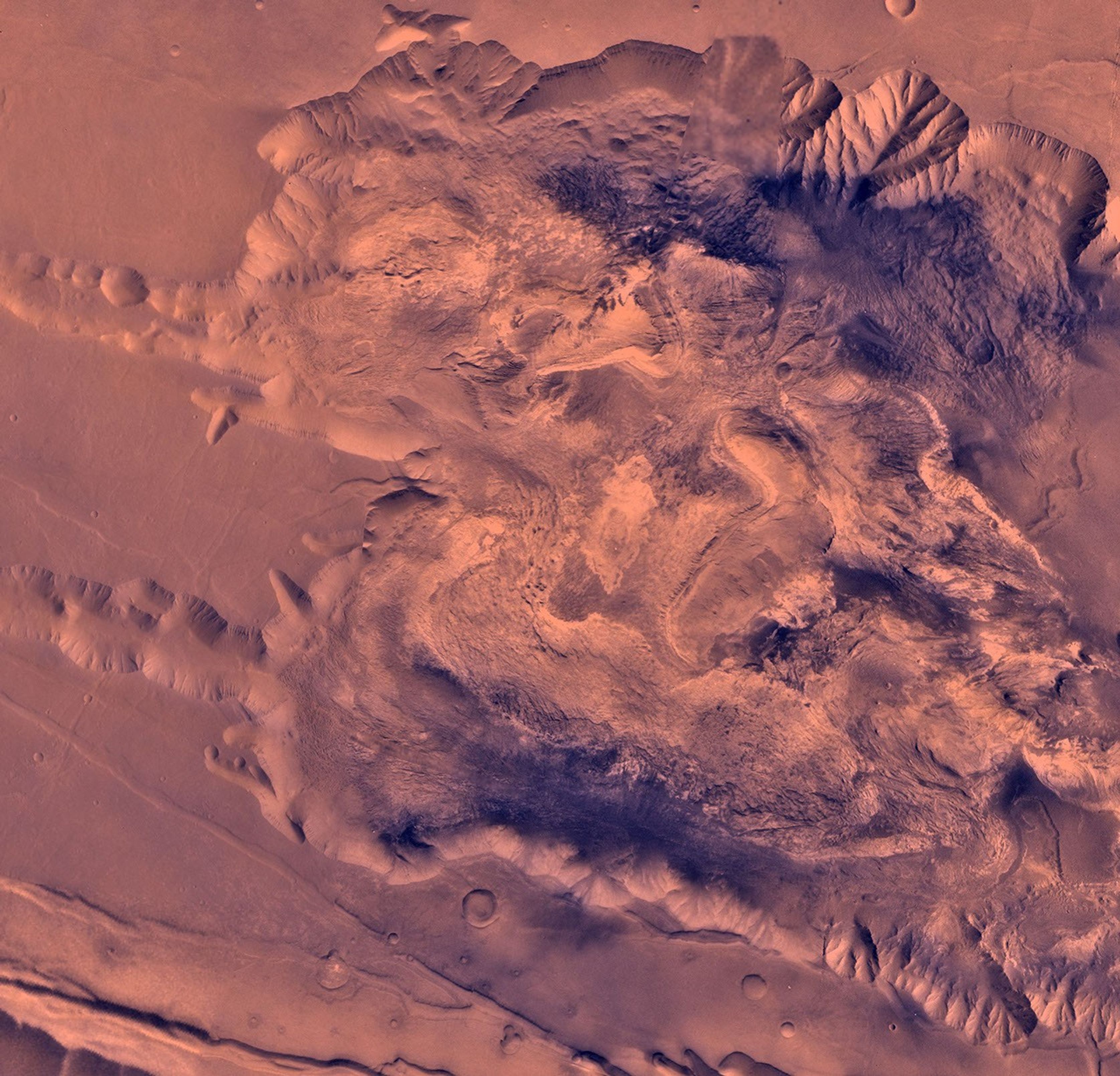 During its examination of Mars, NASA's Viking 1 spacecraft returned images of Valles Marineris, a huge canyon system 5,000 km long, up to 240 km wide, and 6.5 km deep. This view shows west Candor Chasm.
