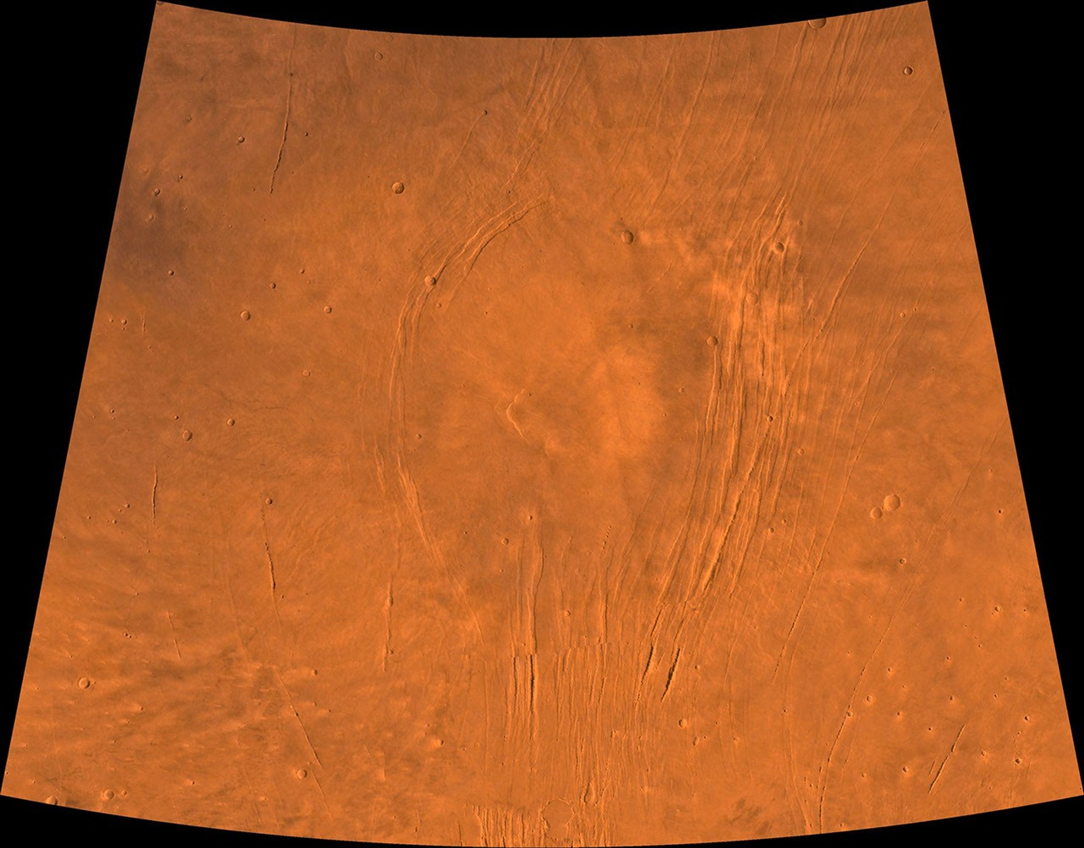 The Alba Patera region of Mars; north toward top. This scene shows a central circular depression surrounded by splays of fractures, named Alba Fossae and Tantalus Fossae, as seen by NASA's Viking spacecraft.