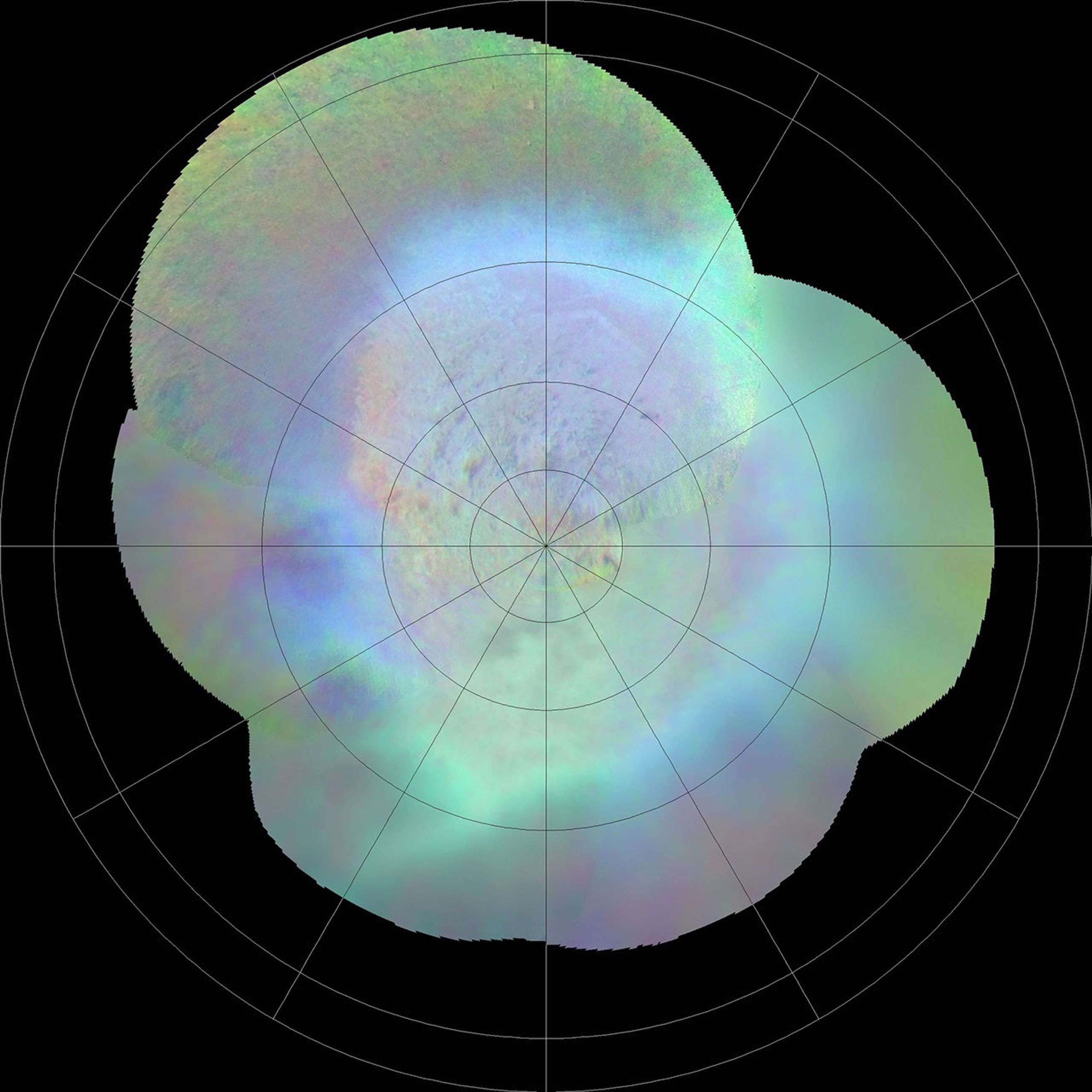 This polar projection from NASA's Voyager 2 of Triton's southern hemisphere provides a view of the southern polar cap and bright equatorial fringe. The margin of the cap is scalloped, bright fringe probably consists of very fresh nitrogen frost or snow.