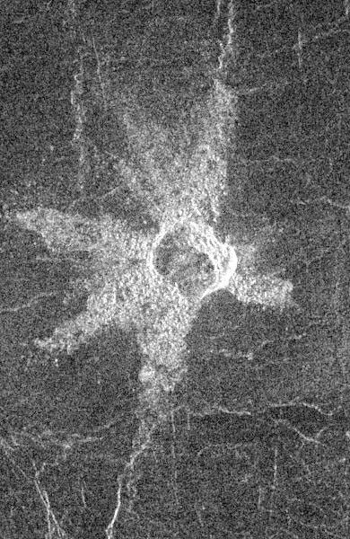 This image from NASA's Magellan spacecraft shows an impact crater in the central Eistla Region of the equatorial highlands of Venus. The crater is slightly irregular in platform and its walls appear terraced.