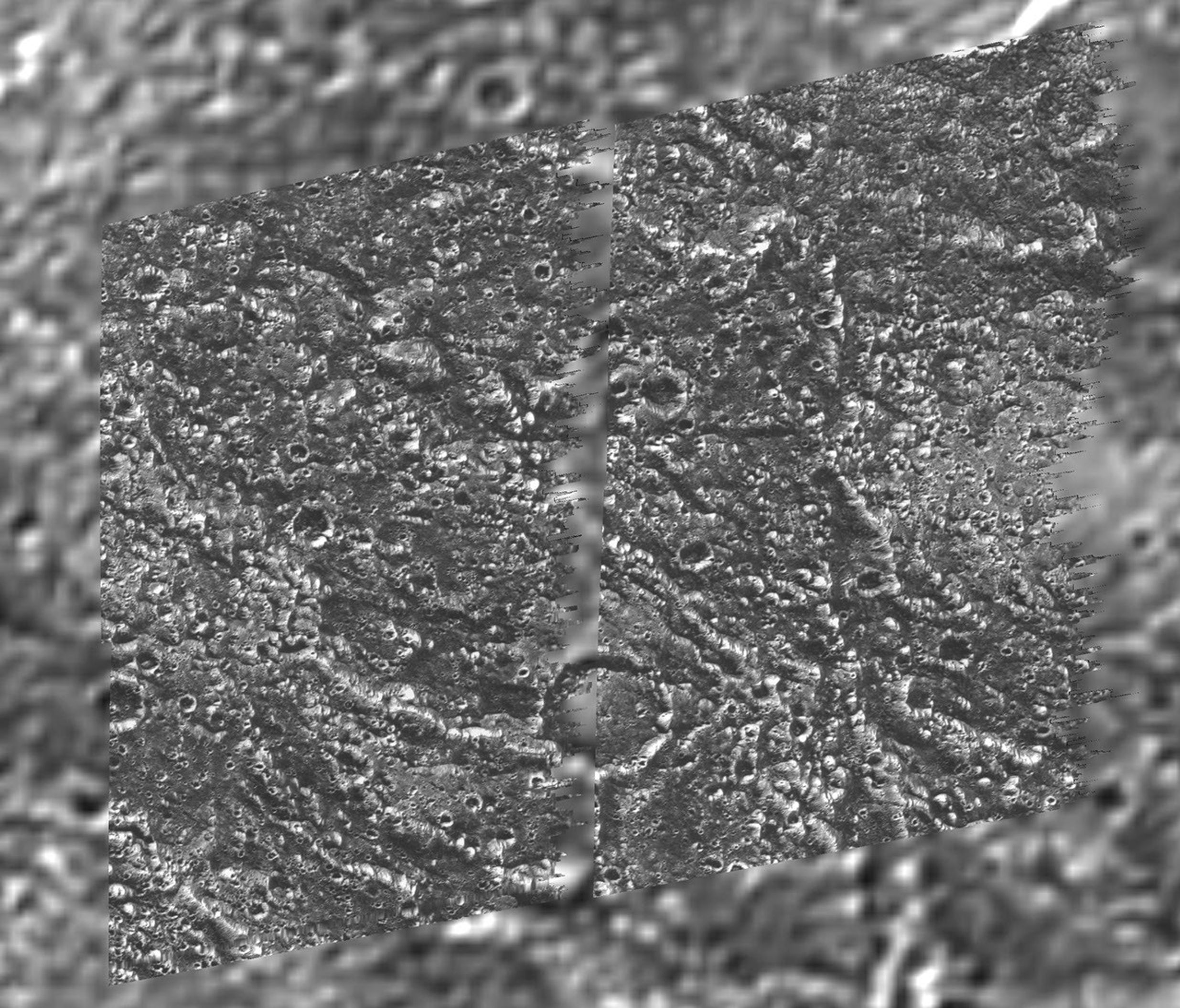 A mosaic of four Galileo images of the Galileo Regio region on Ganymede (Latitude 18 N, Longitude: 149 W) is shown overlayed on the data obtained by NASA's Voyager 2 spacecraft in 1979.