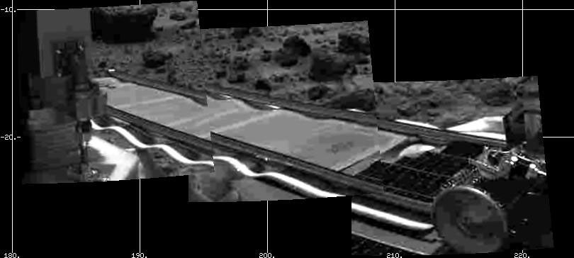 NASA's Mars Pathfinder's forward rover ramp can be seen successfully unfurled in this image, taken at the end of July 5, 1997 (Sol 2) by the Imager for Mars Pathfinder (IMP).