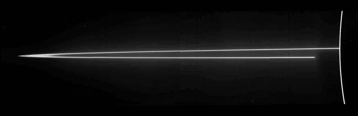 A mosaic of four images taken by NASA's Galileo spacecraft on Nov. 8, 1996, Jupiter's ring system is composed of three parts,a flat main ring, a lenticular halo interior to the main ring, and the gossamer ring, which lies exterior to the main ring.